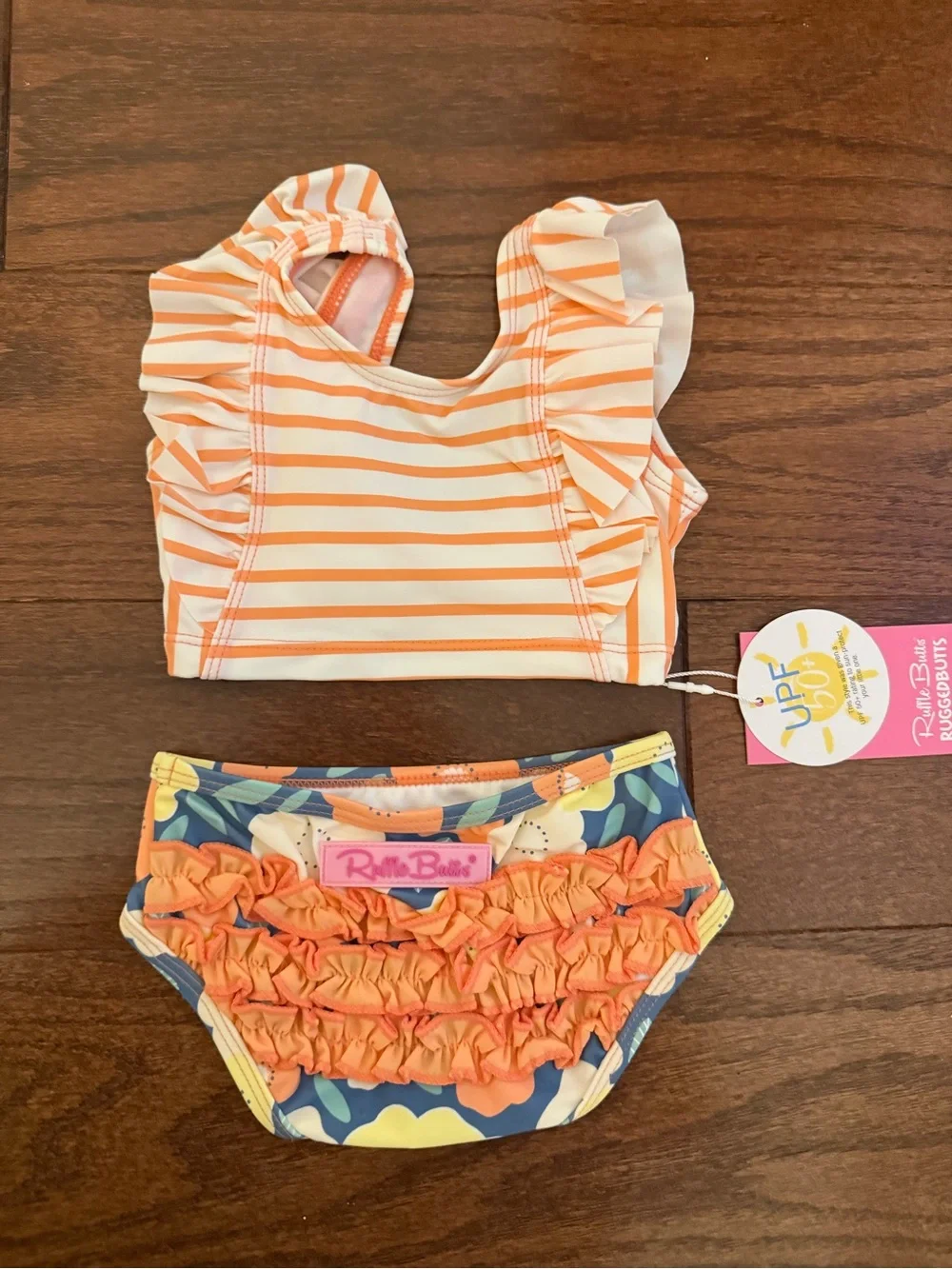 Ruffle Butts Orange and Cream Striped Ruffle Two-Piece Swim Set